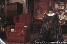 HarryPotter_WB_F1_HarryHoldingInvisibilityCloakInGryffindorCommonRoom_Still_100615_Land.jpg